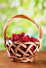 Fototapeta na wymiar Ripe sweet raspberries in basket