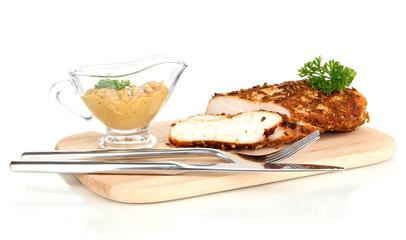 Roasted chicken fillets on wooden board, isolated on white