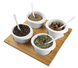 Assortment of spices in  white  bowls,
