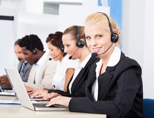 Beautiful Young Woman Talking On Headset