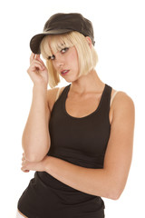 Woman black tank and hat serious touch