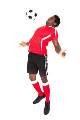 Fototapeta na wymiar Soccer Player Playing With Football