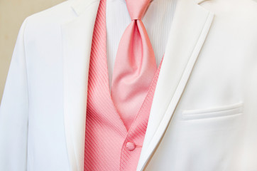 white tuxedo with pink tie