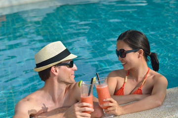 happy young couple relax and take fresh drink