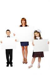 women and children hold a poster