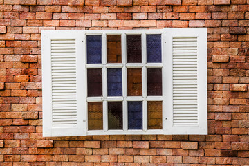 wooden window on the vintage brick wall