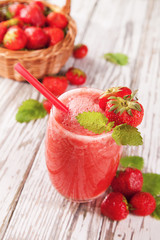 Fresh strawberry drink on wood