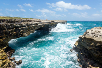 Waves Crashing on Rocks at Devil's Bridge Antigua - obrazy, fototapety, plakaty