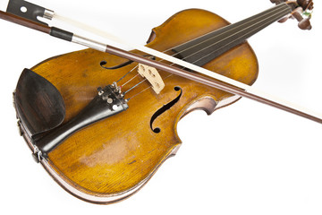 Fototapeta premium Old violin on a white background