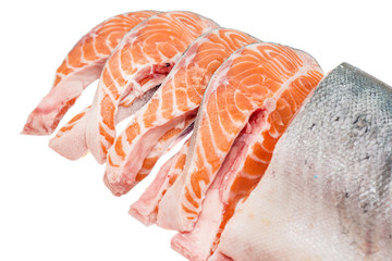 freshly cut salmon steaks on white background