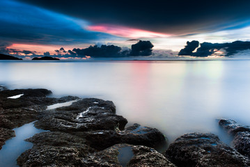 Sunset on the rocky beach