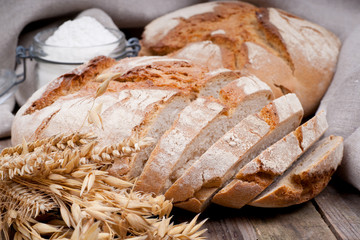 Fresh bread on wooden ground