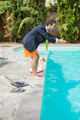 Funny Young Businessman with SwimmingTrunks Diving  into the Poo