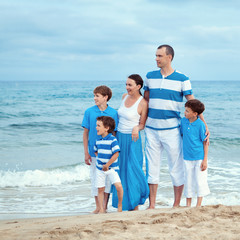 Young family with three kids on vacation