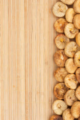 Dried figs  lying on a bamboo mat