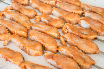 Marinated sturgeon fillets ready for grilling