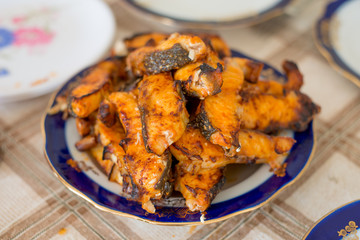 Grilled sturgeon fillets on a dining table