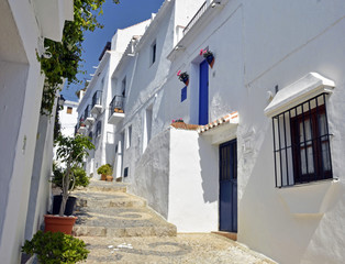 Townhouses along a typical whitewashed village street © neftali