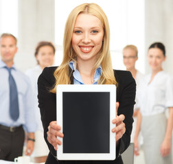 smiling woman with tablet pc in office