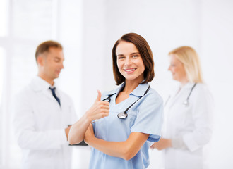 Fototapeta premium team of doctors showing thumbs up