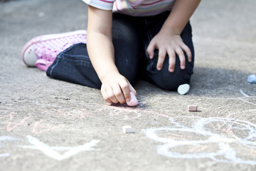 Back to school concept child drawing on the ground