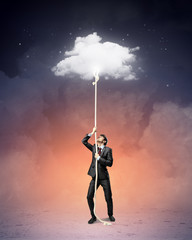 Obraz premium Image of businessman climbing rope