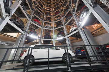 Bottom view of a white car on parking lot