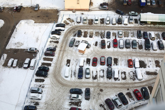 parking lot with many cars in winter