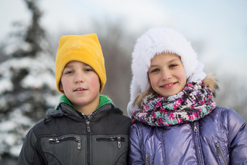 Portrait of a boy with a smiling girl in winter