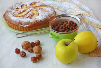 Autum still life with cake and apples, hazel, nut