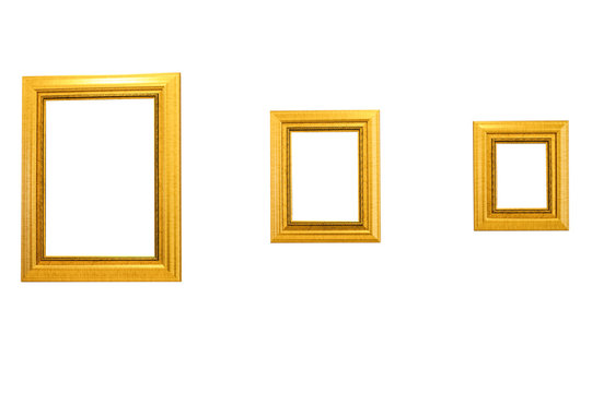three gold picture frames