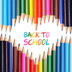 Back to school. Colorful pencils arranged as heart