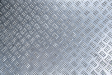 brightly lit corrugated sheet metal