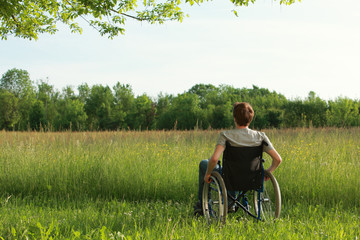 Disabled young man on the park
