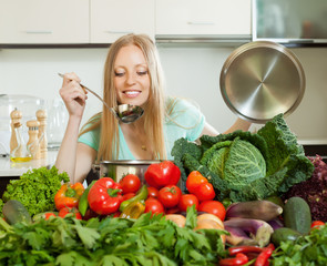  long-haired housewife cooking with fresh vegetables
