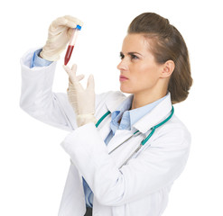 Doctor woman checking test tube