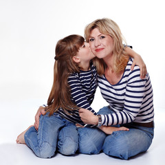 Daughter kissing her mother