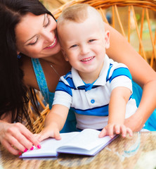 Mother and son reading book