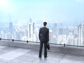Fototapeta premium businessman looking at city