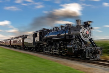 Fototapeta na wymiar historic steam train passes through the fields2