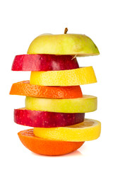 Fototapeta na wymiar Stack of colorful sliced fruit with apple and orange