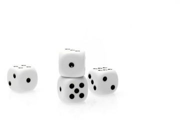 pure white dice on white table with space for text