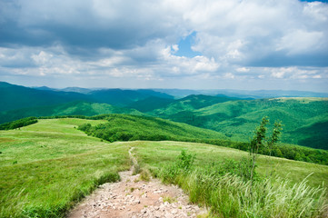 Fototapeta na wymiar Hiking trail in mountains landscape