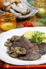 Roasted beef with mushrooms. Autumn table setting