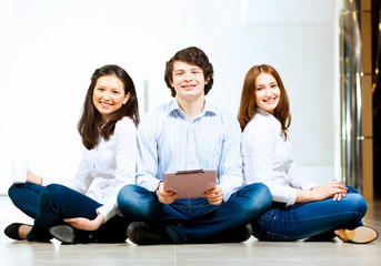 Three students smiling