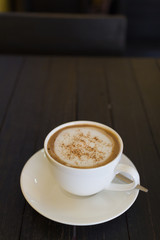 coffee cup on wooden board