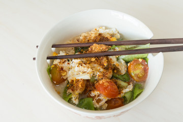 Thai vegetable noodle spicy in white bowl