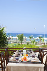 served table on the sea shore in resort