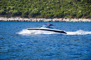 Speed boat on blue water