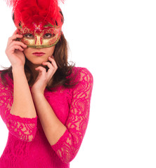 Young woman in a pink dress and red mysterious venetian mask